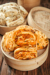 Handmade Steamed Pork Buns with Scallion in Bamboo Steamers - Traditional Asian Cuisine