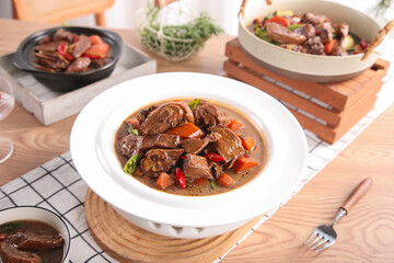 Traditional Braised Duck Stew with Vegetables in Rustic Kitchen Setting
