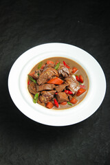 Traditional Stewed Goose with Vegetables in Iron Skillet Style Countryside Cooking