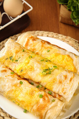 Ham and Egg Pie with Golden Crust and Fresh Chives on Rustic Kitchen Table