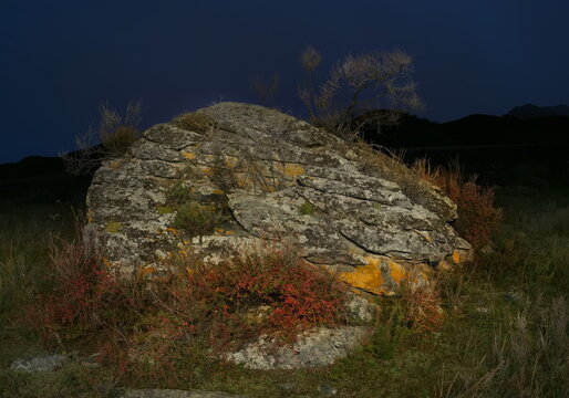 Russia. The South of Western Siberia, the Altai Mountains. Autumn moonlit night in the stone valley of the mountain river Katun near the village of Inia.