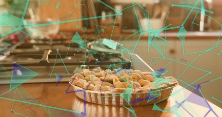 Displaying lattice pie in aluminum tart pan sitting on countertop near gas stove with teal overlay