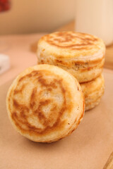 Delicious Golden Puff Pastry Rolls with Savory Filling on Wooden Board