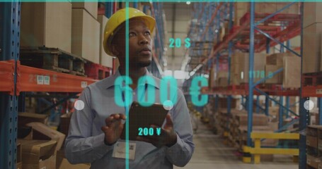 Checking tablet, worker with yellow hard hat, blue shirt in pallet racked aisle, viewing AR data