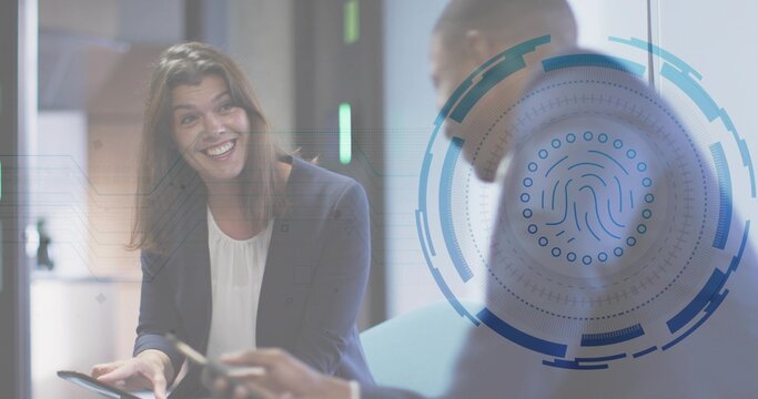 Talking two pros holding tablet, phone in office lounge, wearing navy blazer, suit, biometric UI - Powered by Adobe