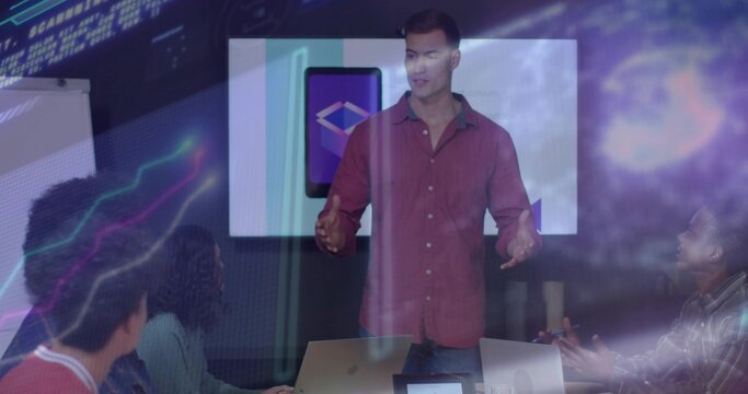 Gesturing presenter in maroon shirt speaking at conference room, with wall display and AR overlay
