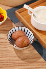 Chinese Tea Eggs with Xiaolongbao Dumplings and Corn Soup Traditional Asian Breakfast Setting