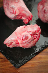Fresh Raw Rabbit Heads on Slate Board - Traditional Chongqing Chinese Cuisine Ingredient