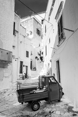 Ape motorcycle in an alley of Ostuni, the white city