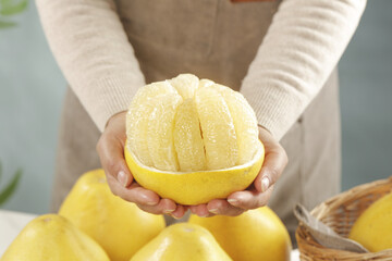 Fresh Sweet Pomelo Citrus Fruit Held in Hands - Healthy Tropical Food