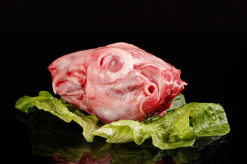 Fresh Raw Rabbit Head on Lettuce Leaves - Traditional Chongqing Chinese Cuisine Ingredient