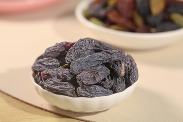 Xinjiang Turpan Black Raisins in White Bowls - Traditional Chinese Dried Fruit from Tulufan Region