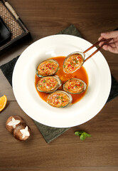 Steamed Abalone with Garlic Vermicelli in Savory Sauce - Traditional Asian Seafood Dish