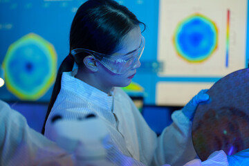 Engineers work in semiconductor or microchip labs in the electronics industry. Electronic engineers in computer technology, CPU maintenance, hardware, motherboard component upgrades.