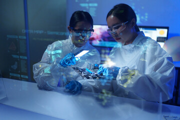 Engineers work in semiconductor or microchip labs in the electronics industry. Electronic engineers in computer technology, CPU maintenance, hardware, motherboard component upgrades.