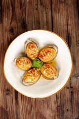 Steamed Abalone with Garlic Vermicelli Noodles Traditional Asian Seafood Dish on Wooden Table