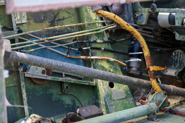 Abandoned Military Helicopter Wreckage and Engine on Display Near Thatched Huts