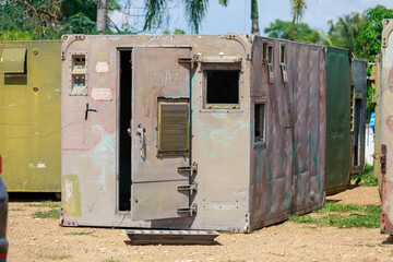 Construction Workers Dismantling and Recycling Old Container Panels Outdoors