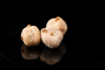 Fried Xinjiang Chickpeas - Crispy Dry Salted Chinese Snack Food on Black Background