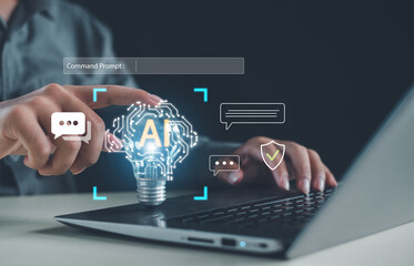 Artificial intelligence and digital communication concept showing a person working on a laptop and touching a glowing AI light bulb, symbolizing innovation, automation, and future technology.