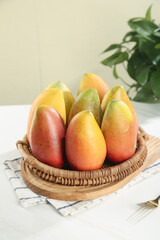 Fresh Tree-Ripened Mangoes in Wicker Basket - Golden Red Tropical Fruit Display