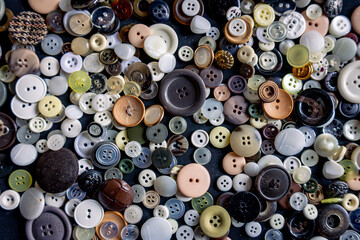Clothes buttons in a pile of different sizes and colors, ready to repair a garment