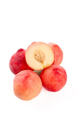 Fresh Summer Peaches Cut in Half Showing Pit on White Background