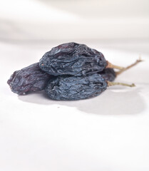 Xinjiang Turpan Black Dried Grapes Tricolor Healthy Organic Fruit Snack on White Background