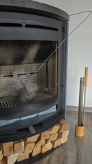 Swedish fireplace with cleaning accessories. How to clean a fireplace at home. Brush for cleaning the chimney.