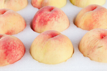 Fresh Summer Peaches from Wuxi China Arranged on White Background - Healthy Fruit Photography