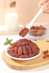 Red Raisins from Xinjiang Turpan China on Wooden Board - Premium Dried Fruit Healthy Snack Food Photography