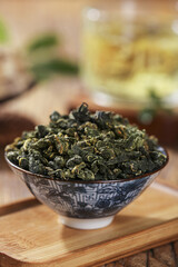 Dried Mulberry Leaves in Ceramic Bowl for Healthy Herbal Tea Recipe and Wellness