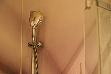 Polished wall mounted rain shower with clean chrome head