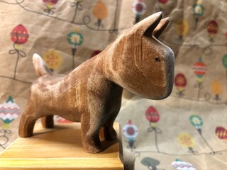 small wooden figurine of a bull terrier