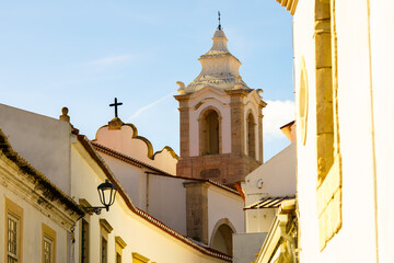 Church tower rises above old town buildings