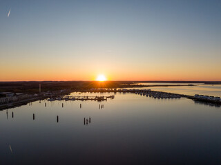 Aerial Sunset View of Olpenitz Harbor - Golden Hour Drone Shot Over Vacation Homes & Marina Baltic Sea Germany