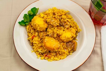 Traditional Brazilian dish of rice, chicken, and pequi ,caryocar brasiliense, known as Goiana chicken stew.	