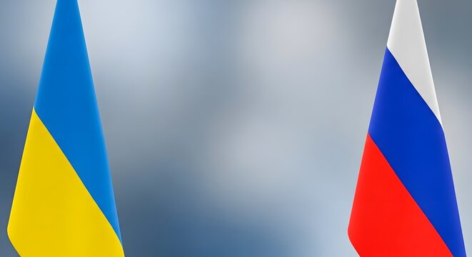 Flags of Ukraine and Russia Together on Blurred Background