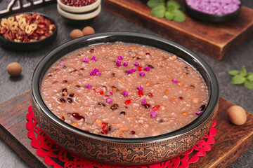 Eight Treasures Congee with Red Beans and Purple Flowers - Traditional Chinese Breakfast Porridge