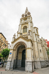 View of a yellow church building in the city of Bilbao, Spain