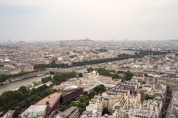 An aerial view of a part of the city of Paris, showing an Orthodox Christian church The church has golden domes, and the streets and the river are visible