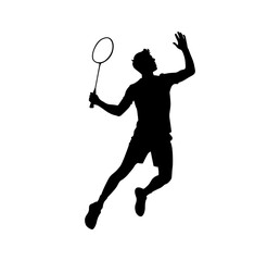 Silhouette of a male badminton player in action jumping to hit the shuttlecock with a racket