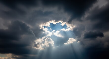 Dark storm clouds part to reveal bright sunlight breaking through, creating dramatic rays of light against a moody sky. Perfect for themes of hope, inspiration, and weather changes.