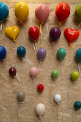 Colorful glazed ceramic balloons and hearts, souvenirs from ols town Lecce, Italy