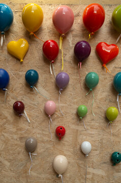 Colorful glazed ceramic balloons and hearts, souvenirs from ols town Lecce, Italy