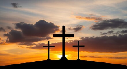 Three crosses stand on a hill against a dramatic sunset sky with orange and golden clouds. Perfect for religious themes, Easter, faith concepts, worship materials, and spiritual content.