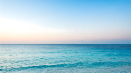 Fototapeta premium Serene Ocean Horizon with Gentle Waves and Soft Pastel Sky water