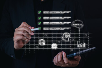 Concept of Agentic AI for business process automation and task management. A businessman uses a stylus on a digital interface to check tasks, analyze data, and manage a smart workflow.