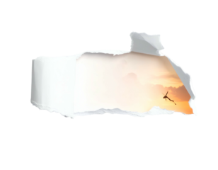 Torn paper reveals silhouette of person jumping against sunset