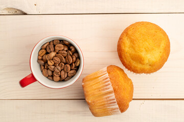 Delicious muffins  on a wooden table, top view, close-up.